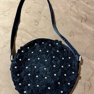 Black cloth Moschino bag with floral appliqués